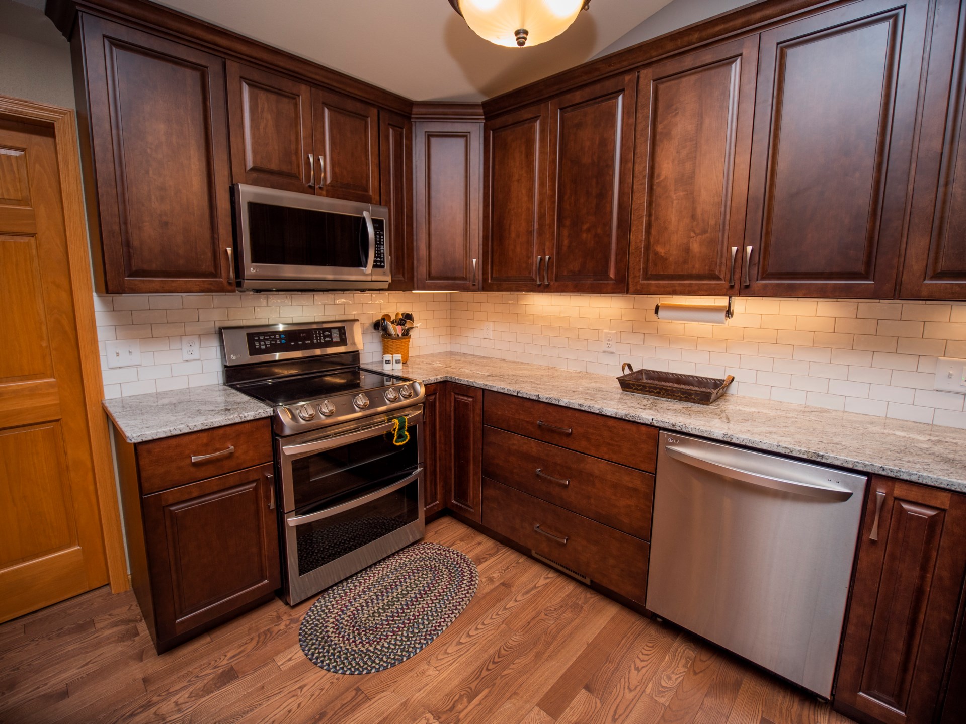 modern kitchen with dark wood cabinets